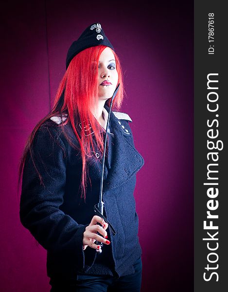 Female dressed in uniform in studio with red hair. Female dressed in uniform in studio with red hair