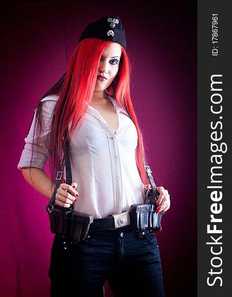 Female dressed in uniform in studio with red hair. Female dressed in uniform in studio with red hair