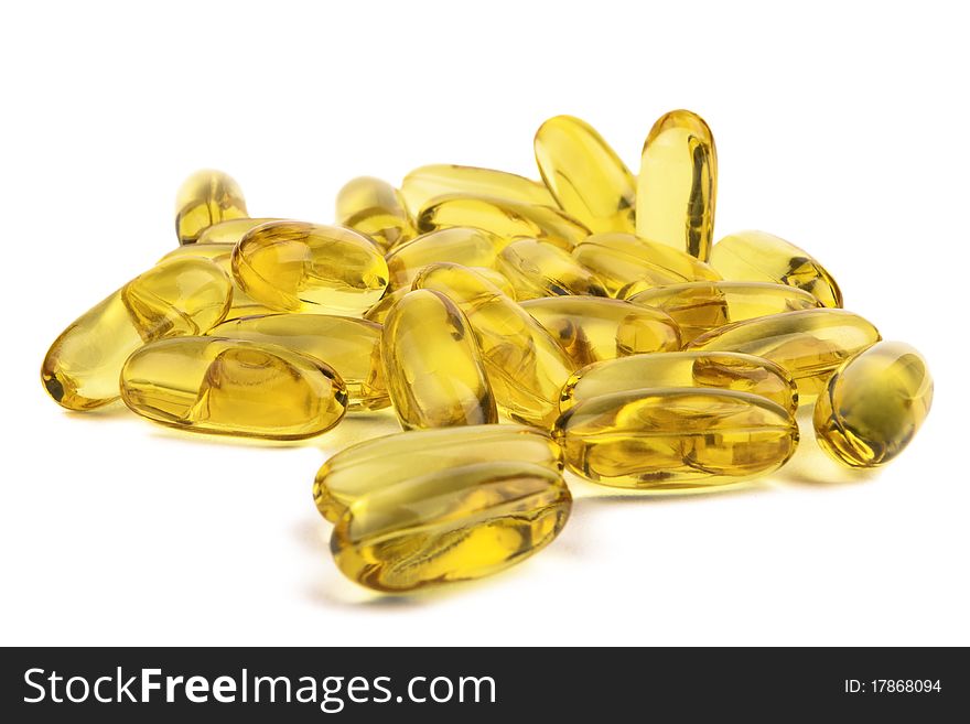 Macro of fish oil gel capsules isolated on white. Macro of fish oil gel capsules isolated on white