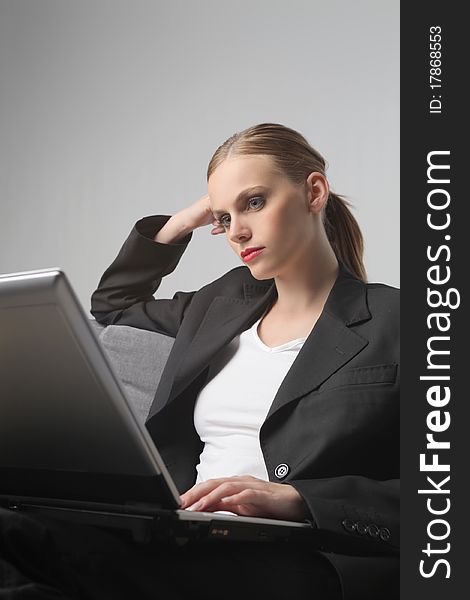 Portrait of a businesswoman using a laptop. Portrait of a businesswoman using a laptop