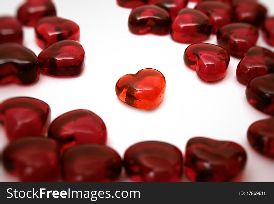 Bright red heart on a white background among others hearts