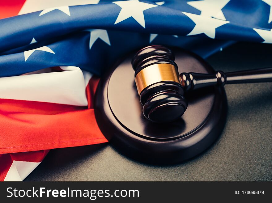 The judge gavel and background with usa flag. The judge gavel and background with usa flag