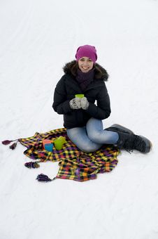 The Young Woman The Brunette Sits On A Checkered P Stock Photo The Young Woman The Brunette Sits On A Checkered P Stock Photo