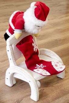Santa Claus On A Wooden Chair Royalty Free Stock Images