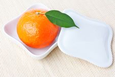 Tangerine On White Plate With Cover Stock Images Tangerine On White Plate With Cover Stock Images