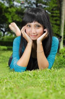 Exotic Asian Girl Smiling And Lying Down Royalty Free Stock Photos Exotic Asian Girl Smiling And Lying Down Royalty Free Stock Photos