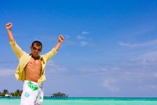Young Man On A Tropical Beach Royalty Free Stock Photos