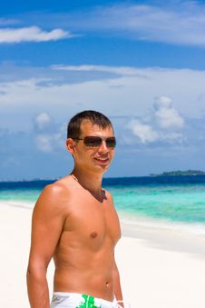 Young Man On A Tropical Beach Stock Photo