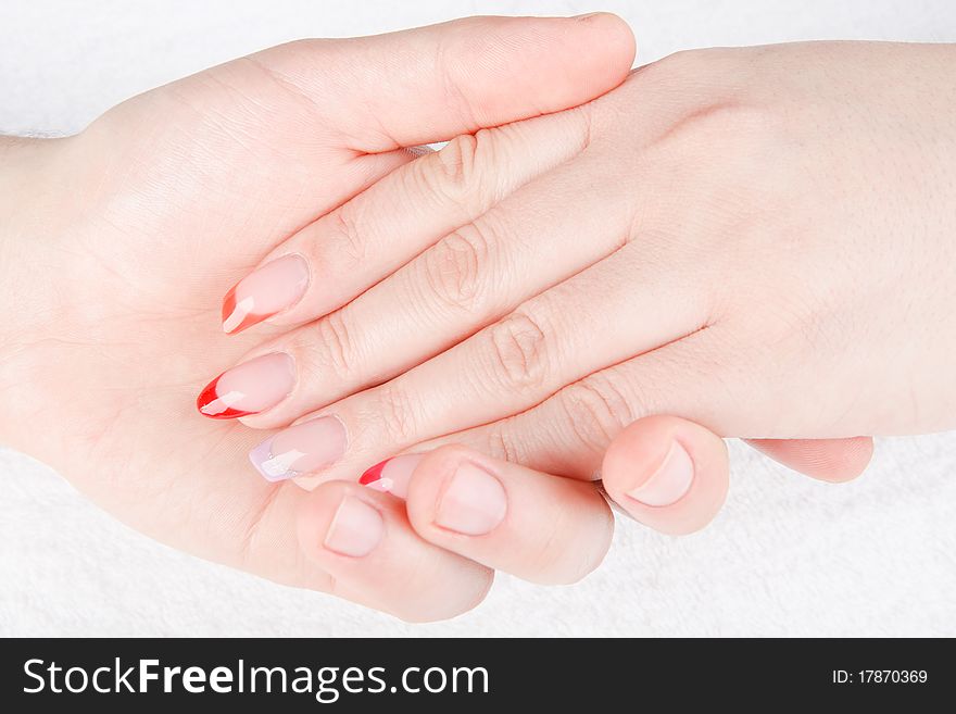 Beautiful woman's hands are doing the male manicure