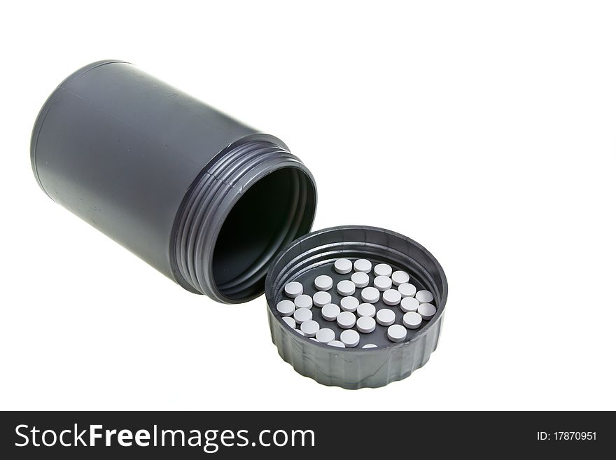 Plastic gray medecine bottle with peels on lid. Plastic gray medecine bottle with peels on lid