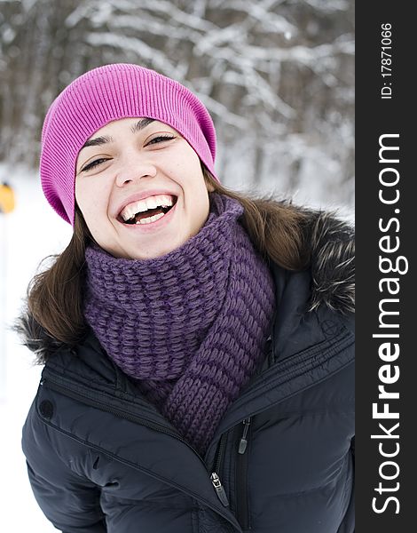 The young woman the brunette in a violet cap laughs