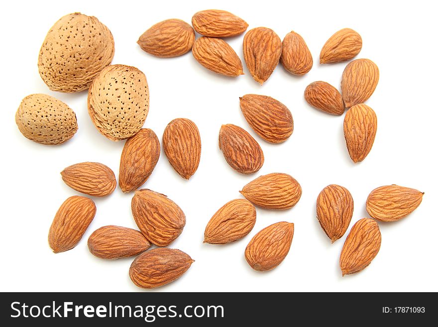 Heap of almond nuts isolated on white background. Heap of almond nuts isolated on white background