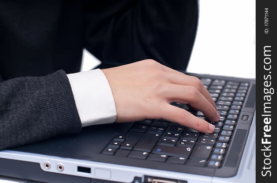 Business man typing at laptop, isolated on white