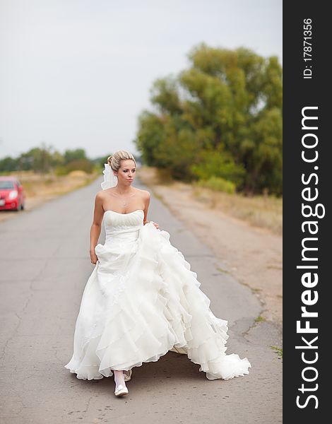 Walking bride on the road