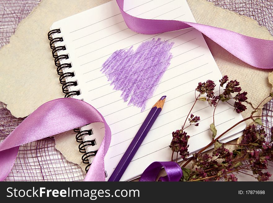 Valentine background with writing-pad, old texturized paper, herbs and shiny ribbons. Horizontal composition. Valentine background with writing-pad, old texturized paper, herbs and shiny ribbons. Horizontal composition