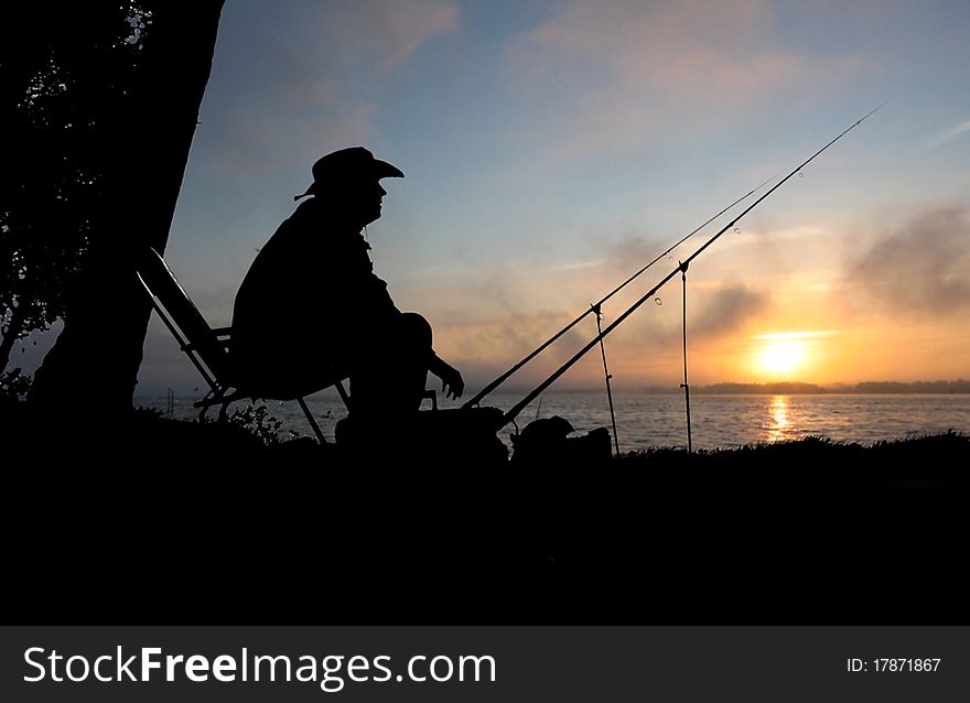 Fishing on background of water the fish man. Fishing on background of water the fish man