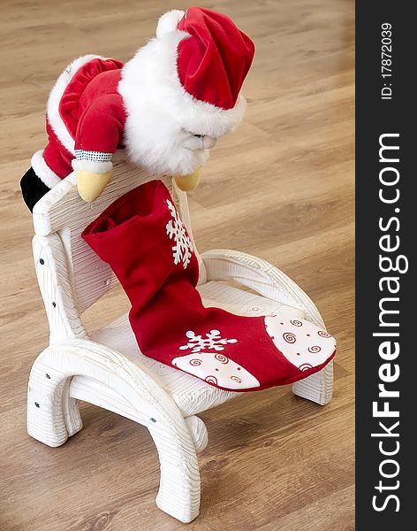 Toy Santa Claus on a wooden chair