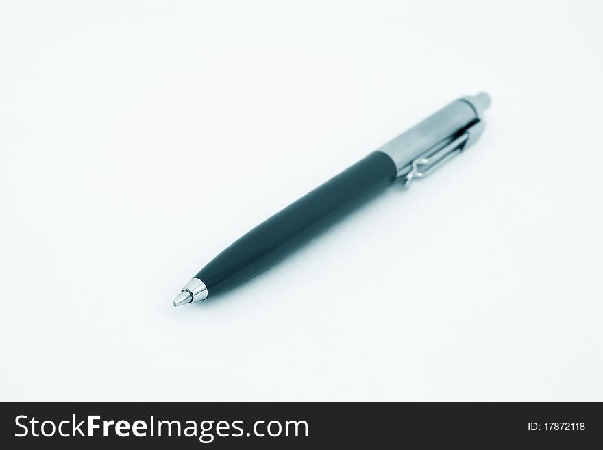 Close-up ballpoint pen. Focus on the tip, isolated on white.