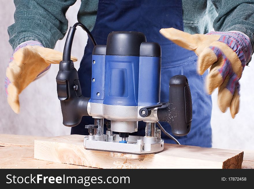 Milling cutter manual electric on a tree close up