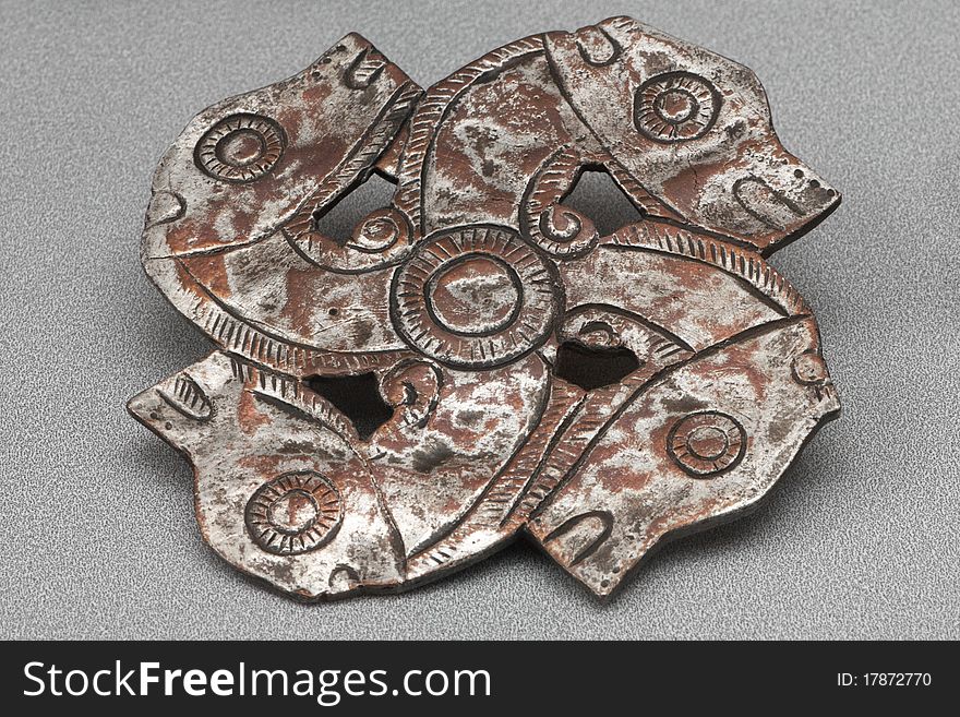 Ancient metalic ornament represent four dragons. Ancient metalic ornament represent four dragons