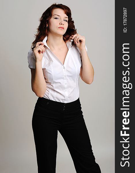 An image of young beautiful woman in white blouse. An image of young beautiful woman in white blouse