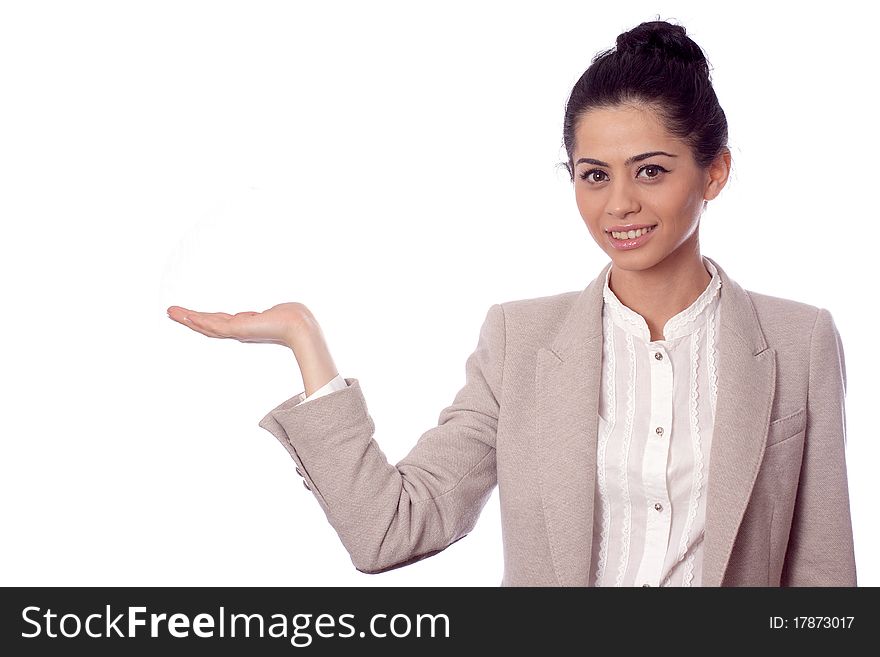 Business woman showing with hand on white space and smiling