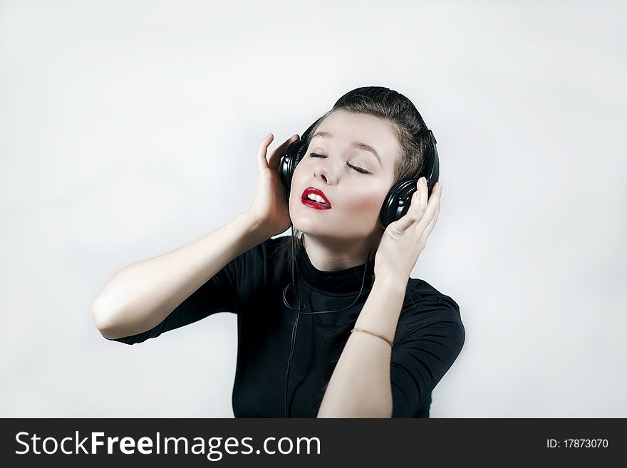 Pretty young girl listening music