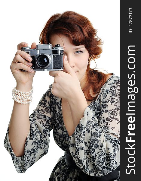 An image of a woman with a camera in her hands. An image of a woman with a camera in her hands