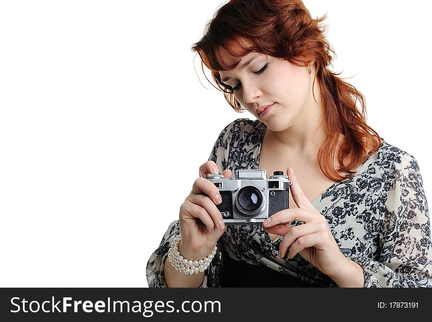 An image of a woman with a camera in her hands. An image of a woman with a camera in her hands