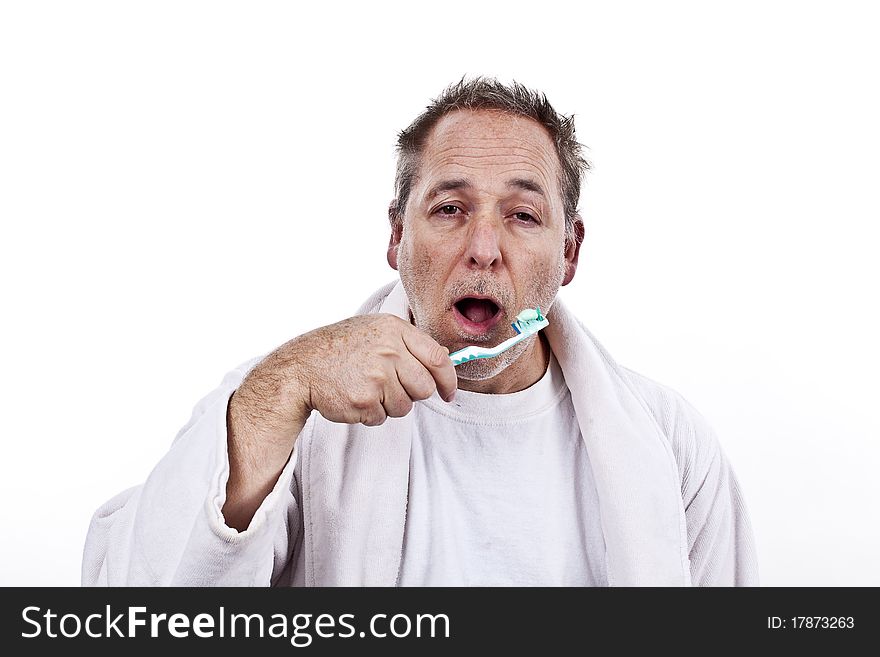 Closeup of a 45 year old men brushing his teeth in the morning. Closeup of a 45 year old men brushing his teeth in the morning