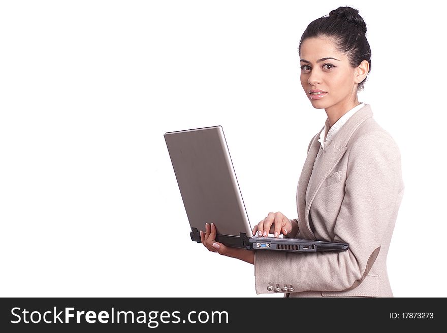 Young business woman holding a laptop isolated