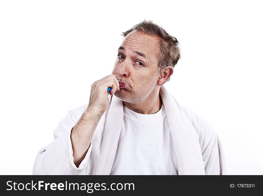 Closuup of a 45 year old men brushing his teeth in the morning. Closuup of a 45 year old men brushing his teeth in the morning