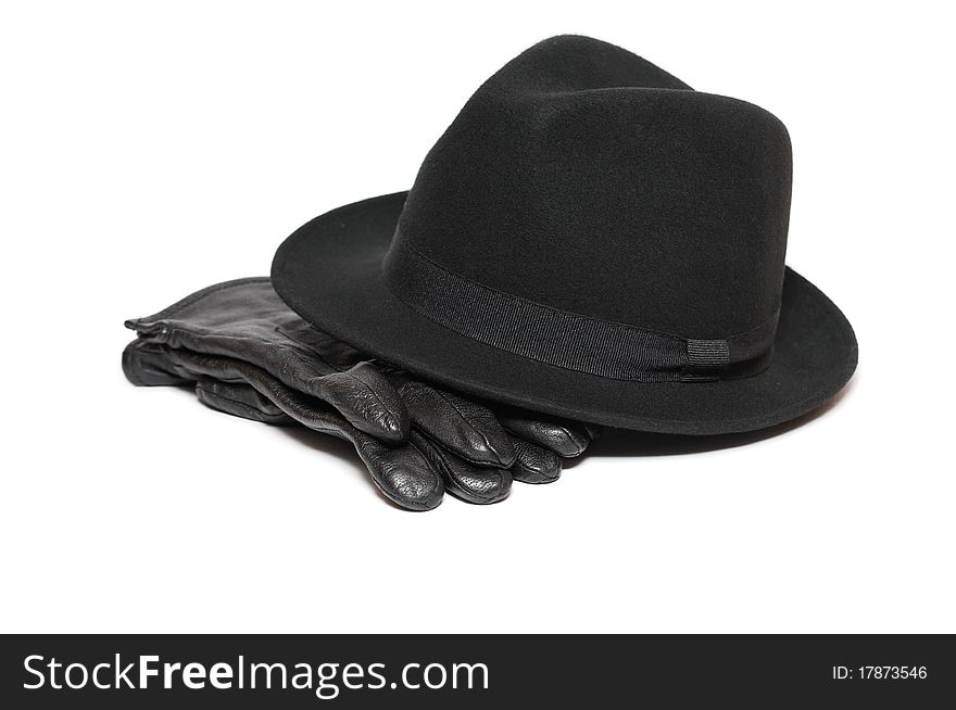 Felt hat and pair of leather gloves on white background. Felt hat and pair of leather gloves on white background