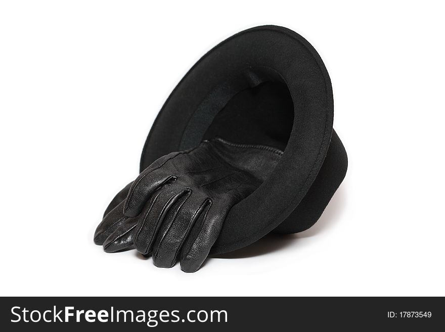 Felt hat and pair of leather gloves on white background. Felt hat and pair of leather gloves on white background