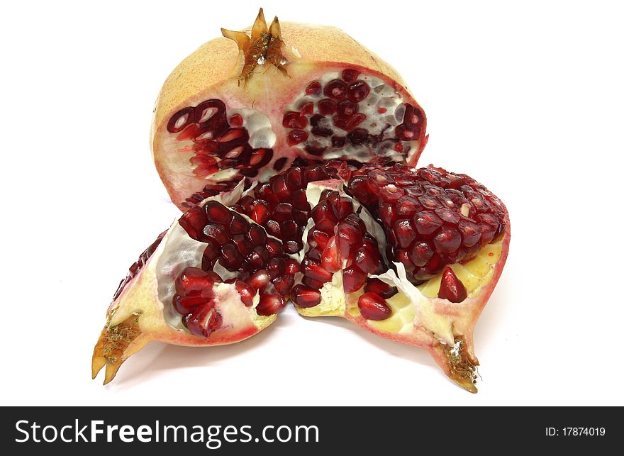 Pomegranate fresh and healthy, open over a white background