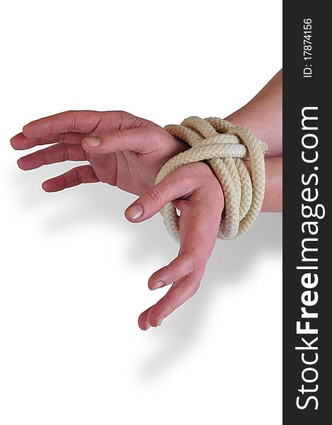 It photographs of two woman hands tied with a rope. It photographs of two woman hands tied with a rope
