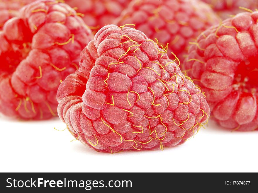 Ripe raspberry on a white background