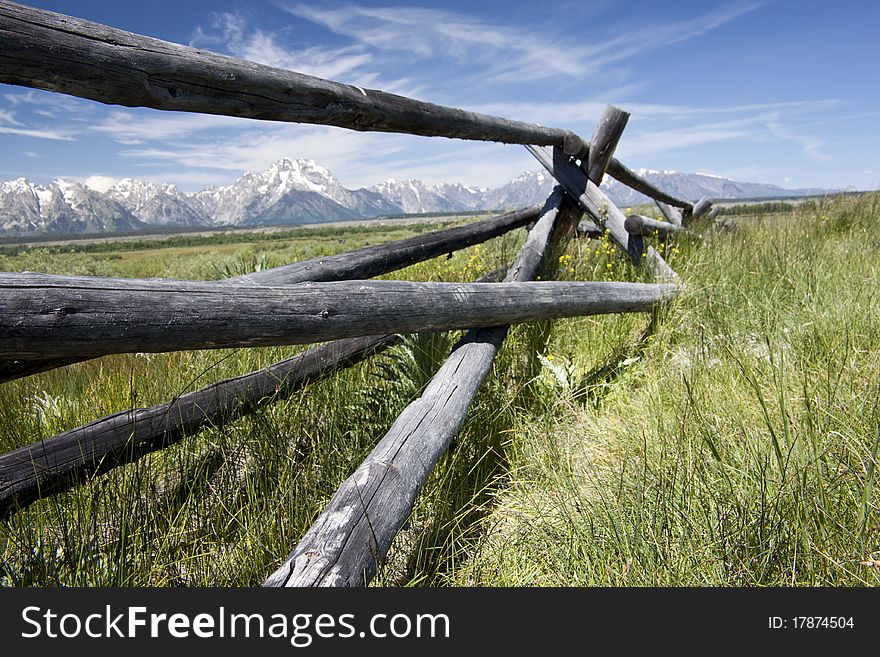 Wood fence frames Tetons.