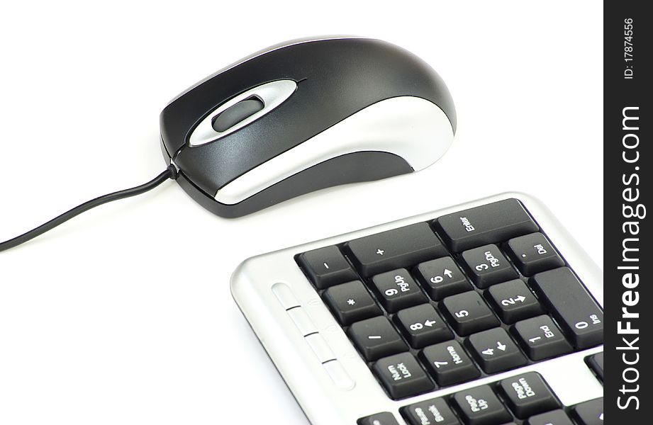 Computer mouse and keyboard isolated on white