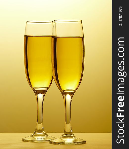 Two champagne glasses in toast