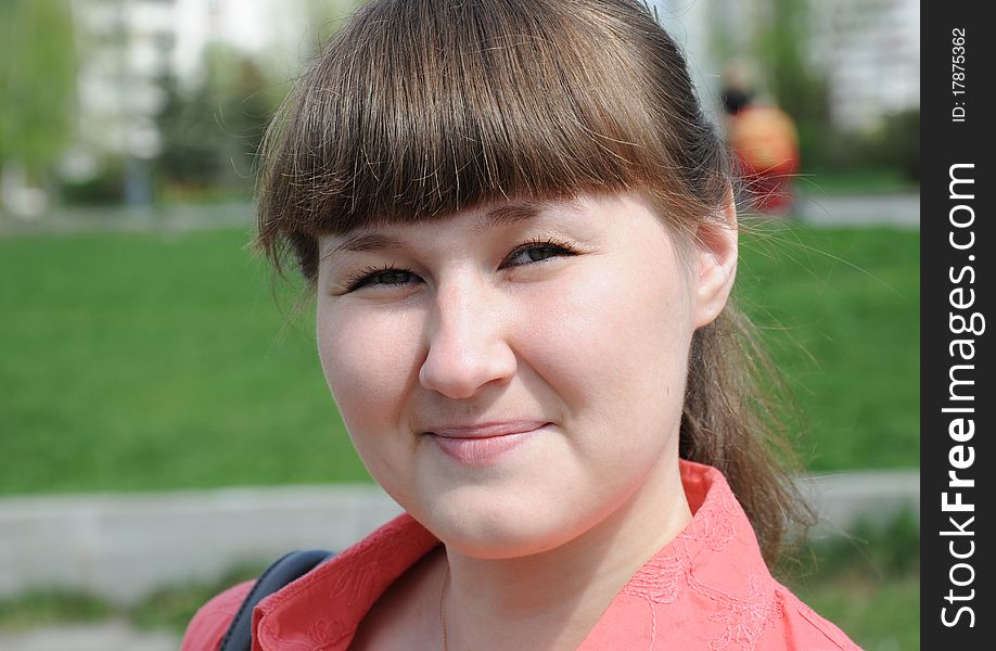 Outdoor portrait of squinting attractive young woman. Outdoor portrait of squinting attractive young woman