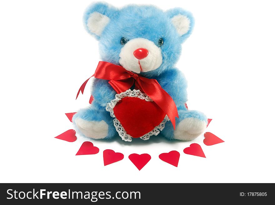 Toy bear with a red bow and the heart, isolated on a white background. Toy bear with a red bow and the heart, isolated on a white background