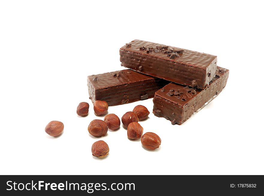 Wafers in chocolate with a nut are isolated on a white background