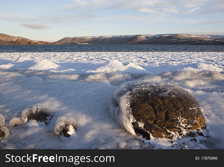 Frozen Ice lake and rock in Iceland. Frozen Ice lake and rock in Iceland
