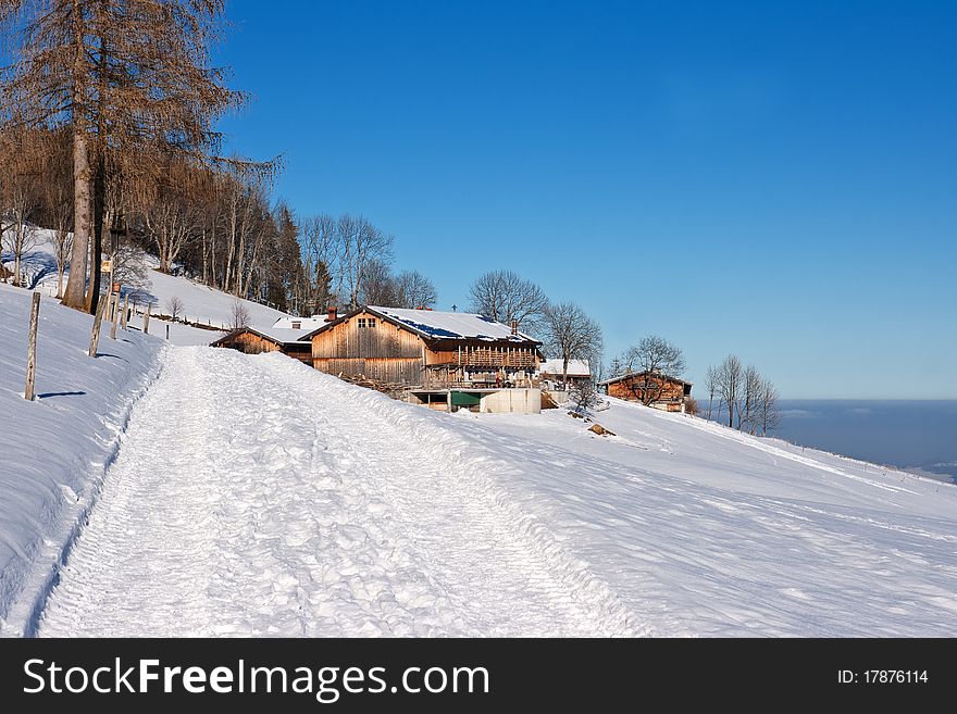 Winter hiking in the bavarian alps with blue sky