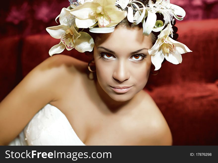 Young woman with an erotic look and flowers