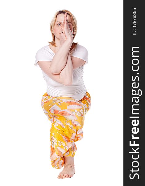 Young woman doing yoga exercise. isolated