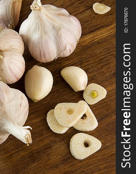 Set of garlic on wooden texture