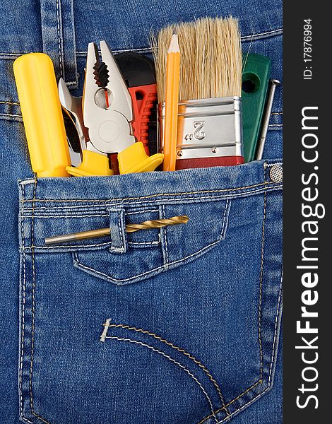 Tools and instruments in blue jeans pocket