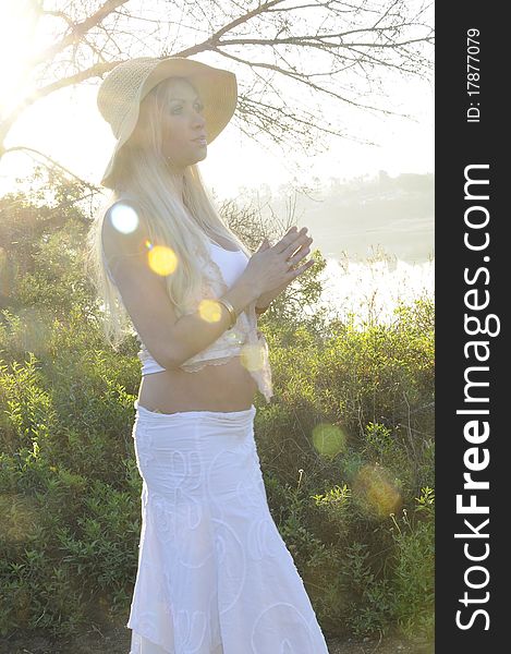 Woman in early pregnancy enjoying the morning light